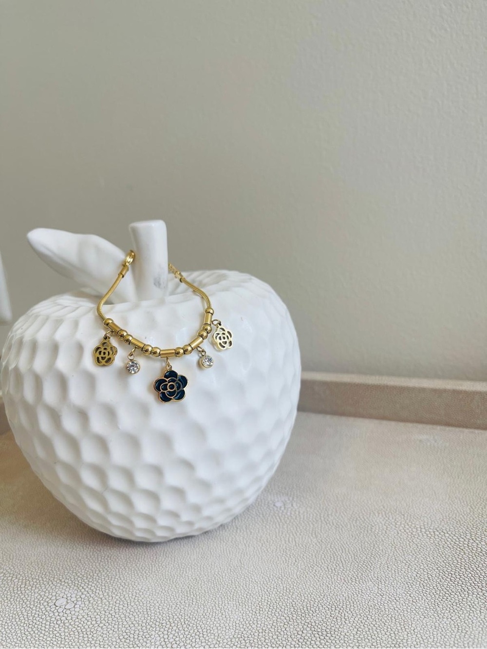 Gold-tone Flower Charm Bracelet with Navy Enamel Accent